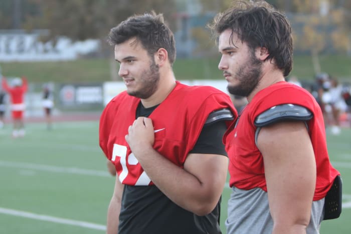 Wade and Brent Helton looking on.